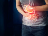 Woman touching stomach painful suffering from stomachache causes of menstruation period, gastric ulcer, appendicitis or gastrointestinal system disease. Healthcare and health insurance concept